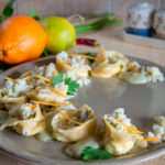Tortelloni agli agrumi con ragù di merluzzo e topinambur